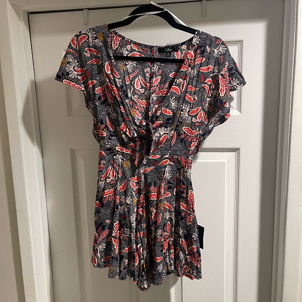 Adorable Dondi Navy Blue Print Romper perfect for your next vacation or summer - Picture 2 of 5